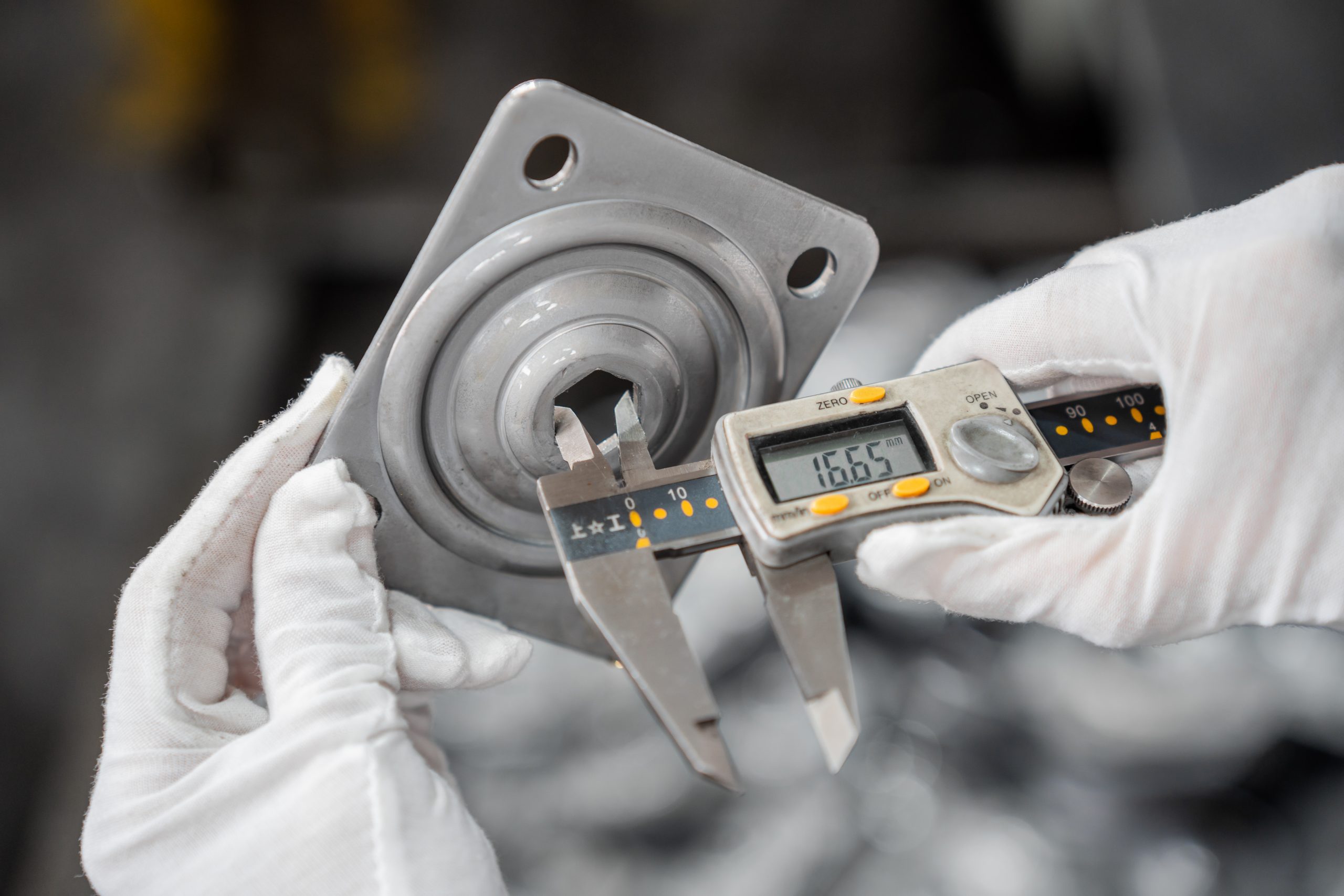 Worker is measuring the caster shell